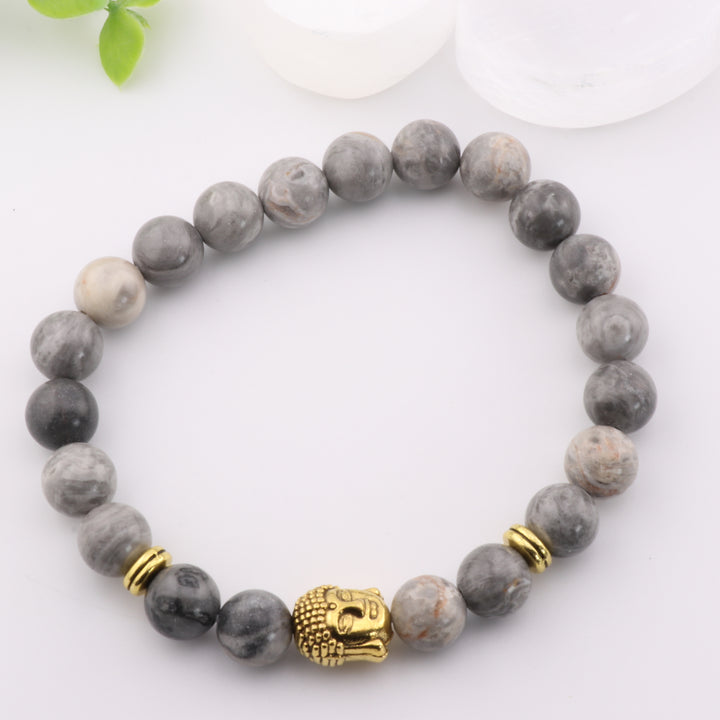 Pulsera de jaspe gris natural con detalle de cabeza de Buda dorada - Cuentas de 8 mm - Joyería de cristal curativo