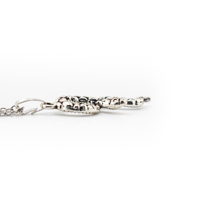 Mystic Serpent Charm: Handcrafted Silver-Colored Brass Snake Pendant