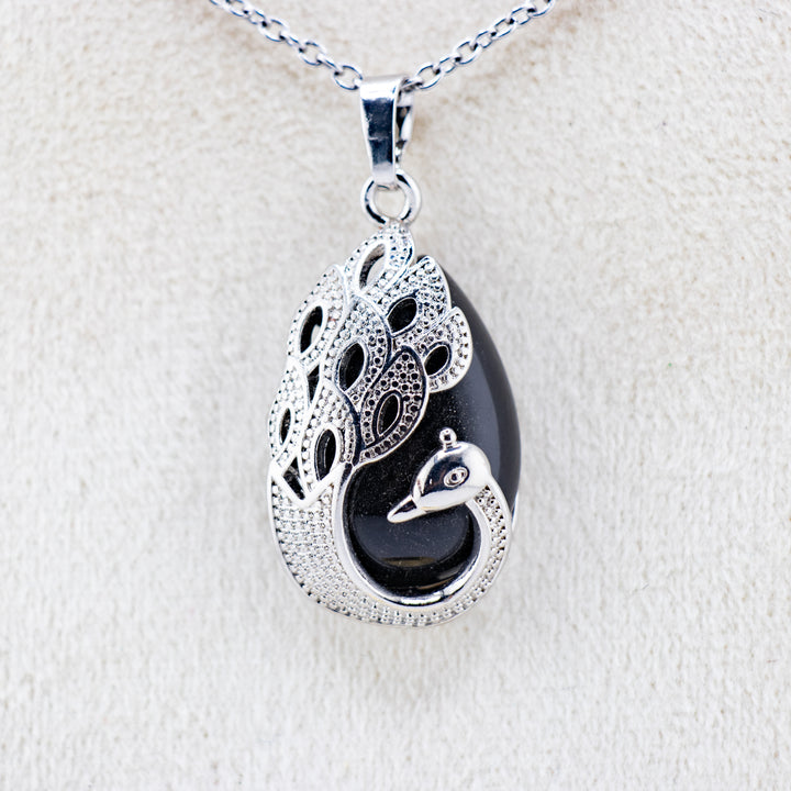 Pendentif en agate noire en forme de larme, fabriqué à la main, inspiré du paon