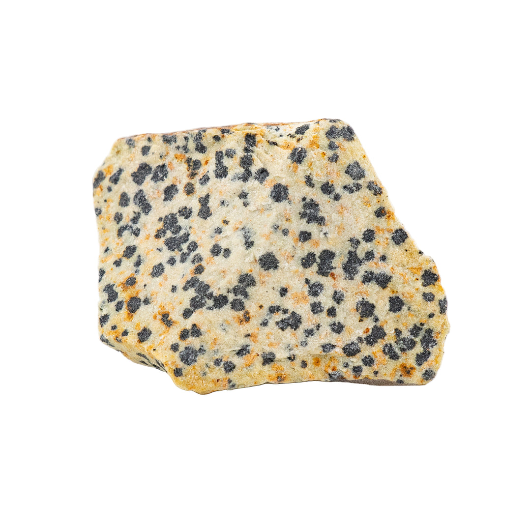 A rough crystal stone with a unique spotted pattern, beige background with black speckles, isolated on a white background.