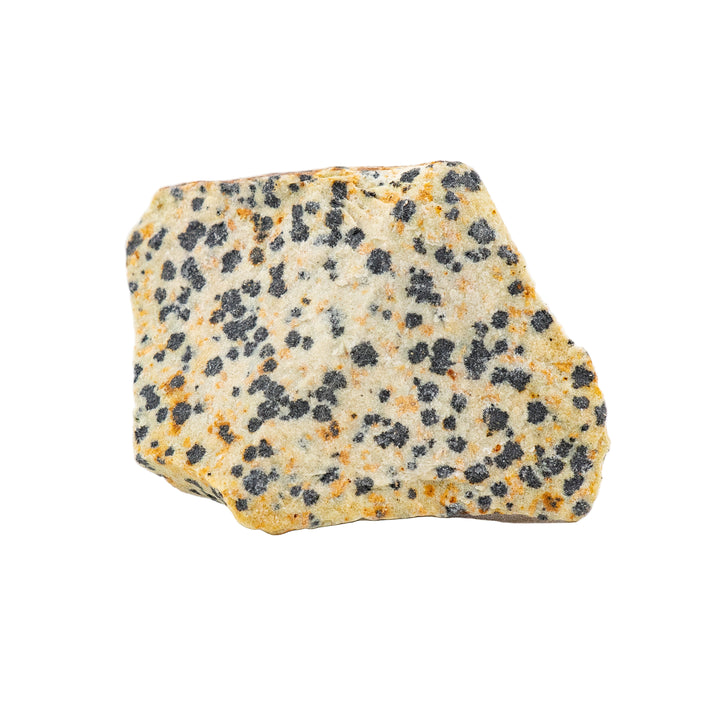 A rough crystal stone with a unique spotted pattern, beige background with black speckles, isolated on a white background.