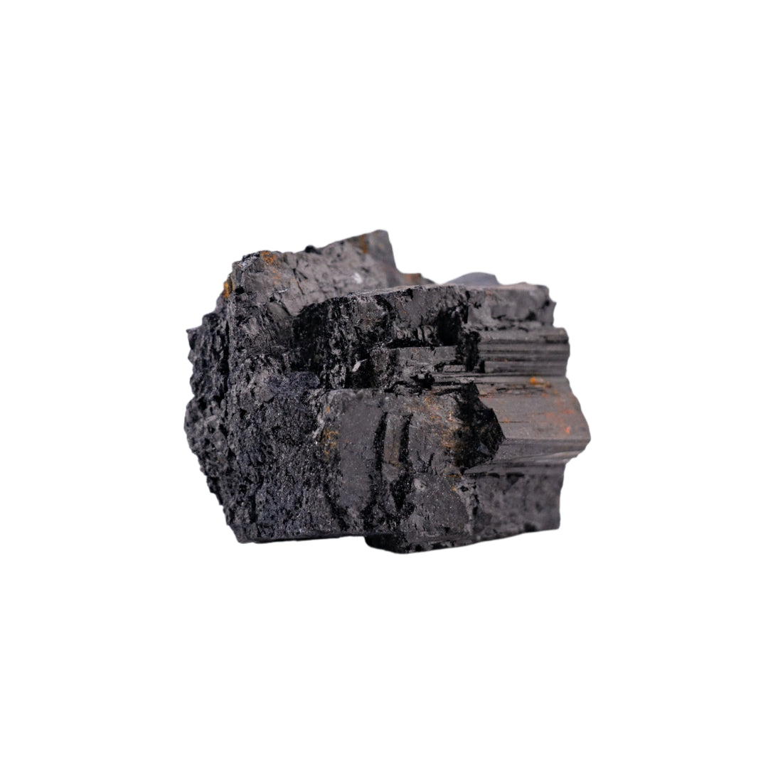 Raw black tourmaline crystal with rough textured surfaces and crystalline facets