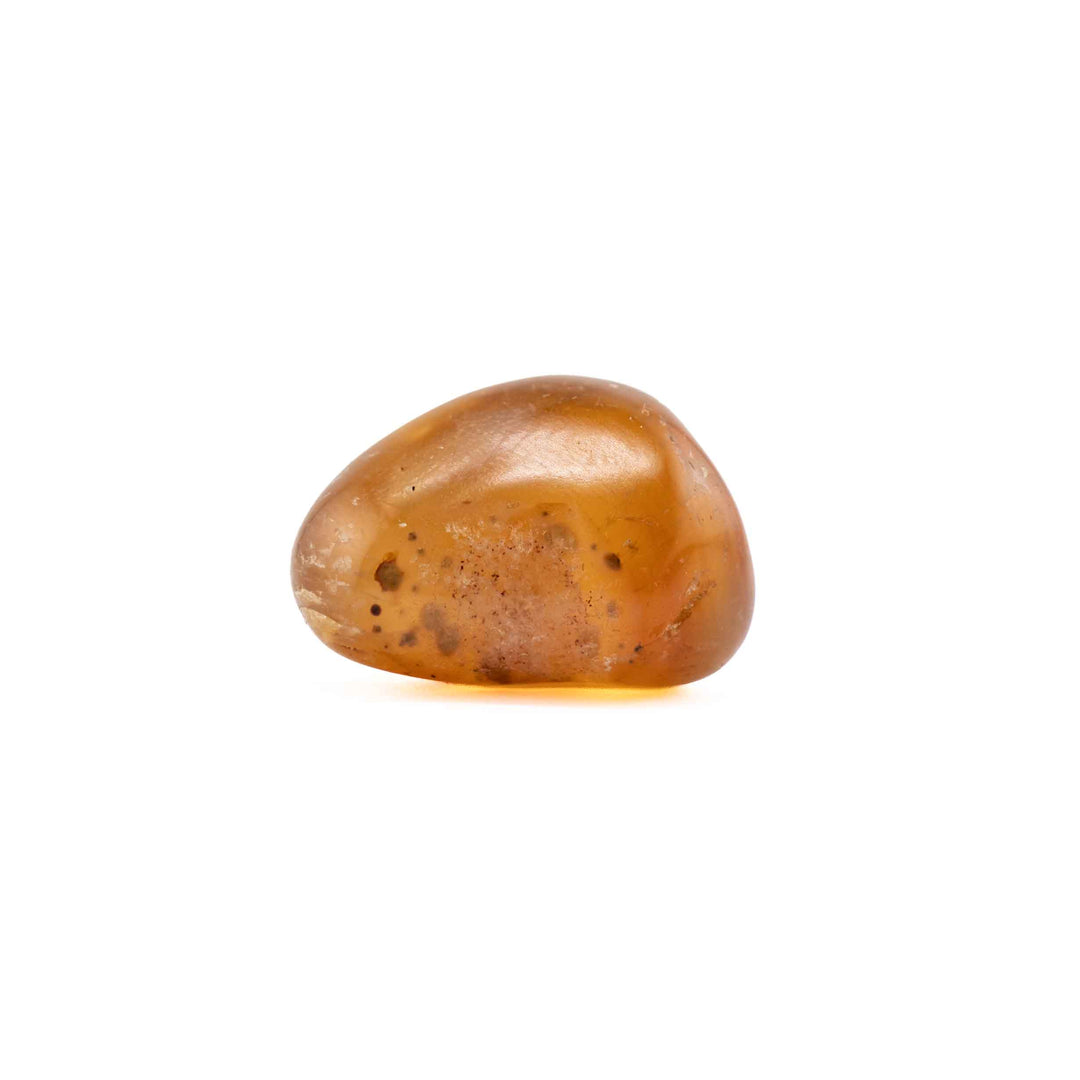 A single, smooth amber agate tumbled stone centered on a solid white background.