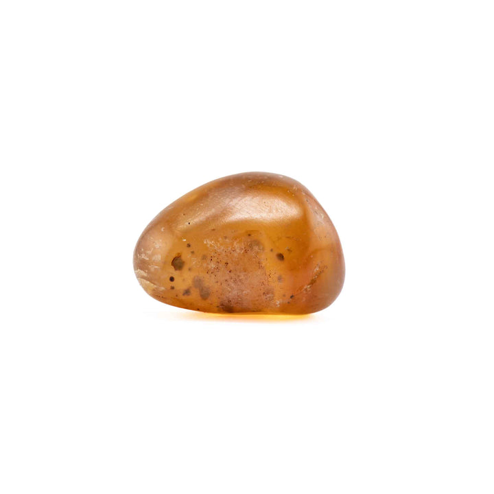 A single, smooth amber agate tumbled stone centered on a solid white background.