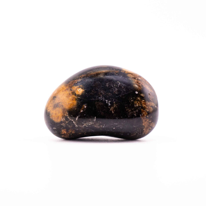 A kidney-shaped, polished agate stone positioned horizontally in the center of a white backdrop.