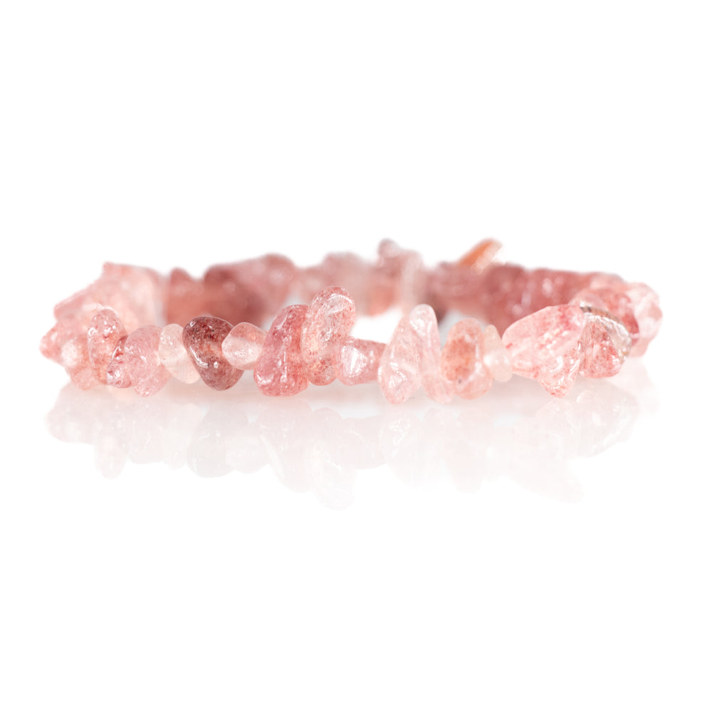 A strawberry quartz chip bracelet featuring irregular pink gemstone beads with a clear reflection on a white studio background