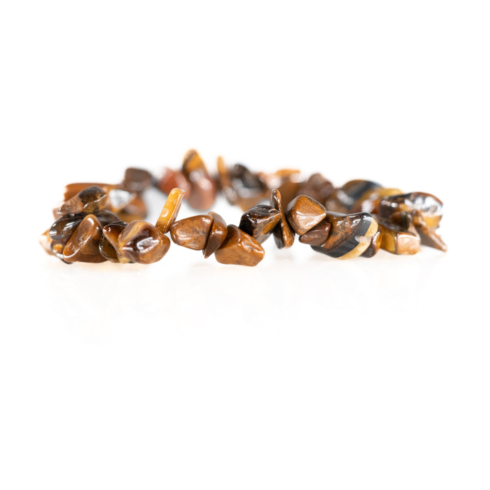 Digital photograph of a stretch bracelet made of tumbled, irregularly shaped tiger's eye stones displaying rich brown and golden chatoyancy on a reflective white background