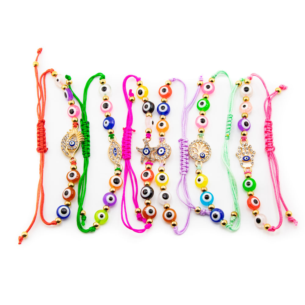 Jewelry a vibrant display of adjustable evil eye protection bracelets featuring multi-colored braided cords diverse glass evil eye beads in hues like blue orange pink and green and gold-toned charms including Hamsa hands a tree of life and a rhinestone-embellished evil eye