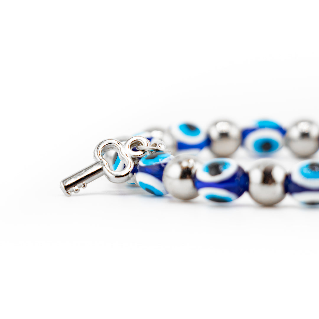 Bracelet de protection Nazar contre le mauvais œil avec perles en plastique argentées de 8 mm