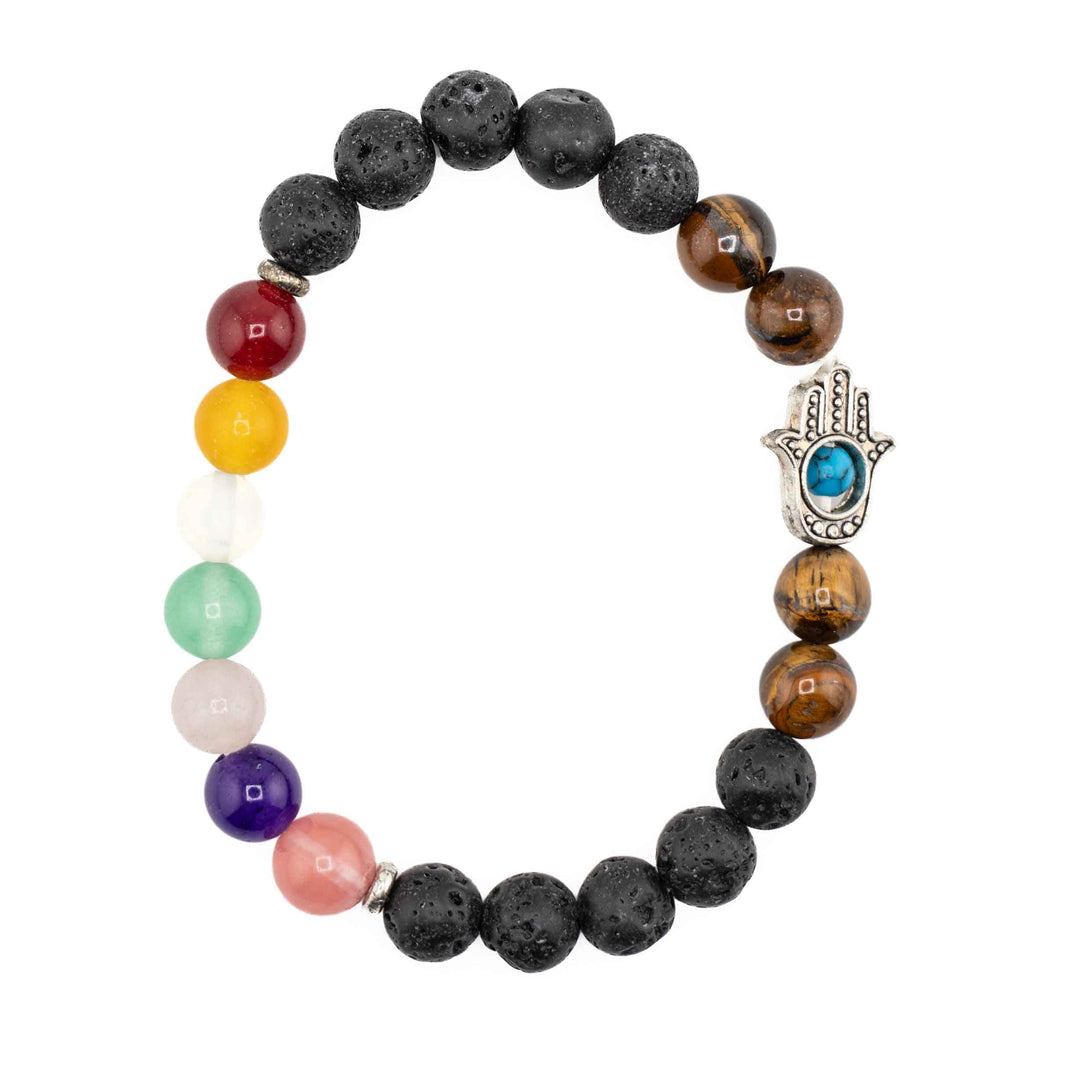 Black porous lava stone chakra bracelet with golden tiger eye beads, multicolored gemstone accents, and a silver Hamsa hand charm featuring a turquoise evil eye centerpiece