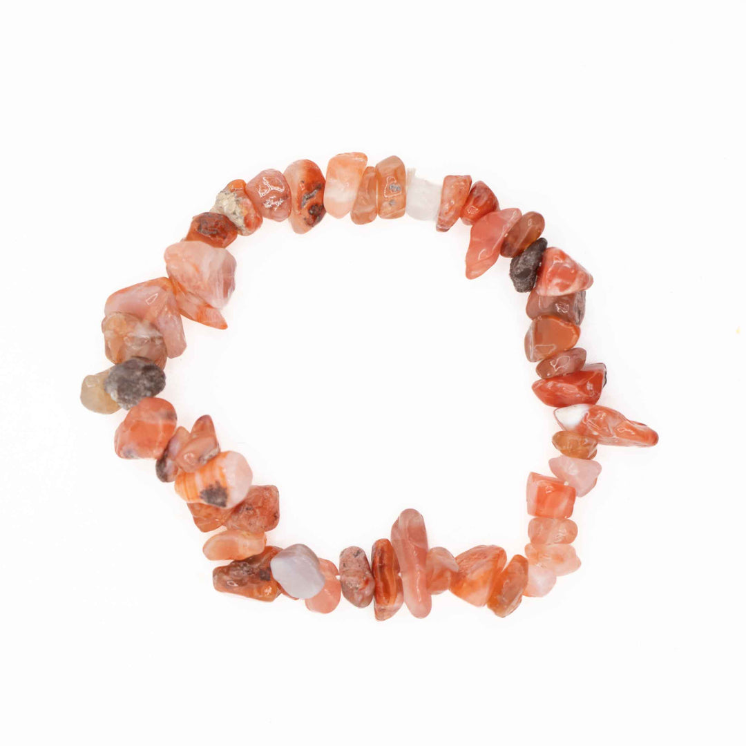 Carnelian chip stone stretch bracelet made with irregular, tumbled gemstone chips in warm shades of orange, terracotta, and peach