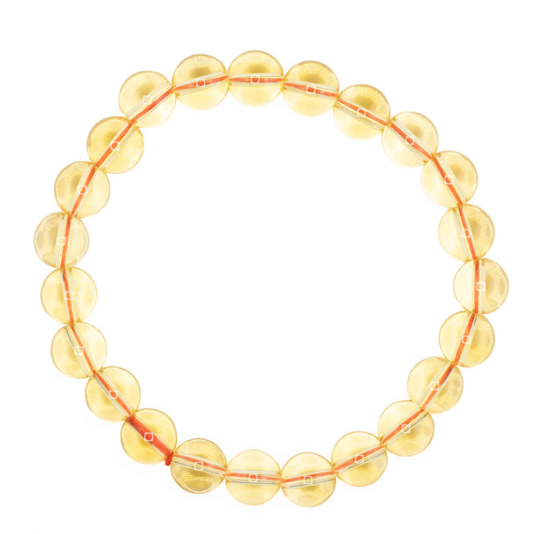 Translucent yellow Citrine beaded stretch bracelet featuring clear round gemstone spheres with a visible orange inner cord