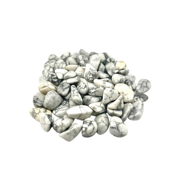 A pile of polished white Howlite tumble stones showcasing prominent gray matrix veining and irregular smooth shapes