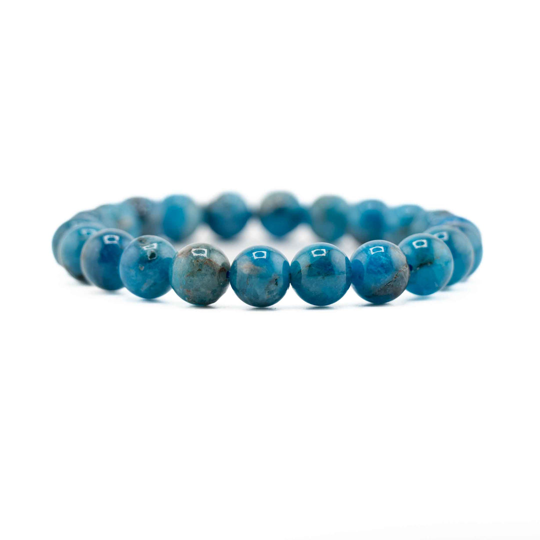 Blue beaded bracelet on a white background