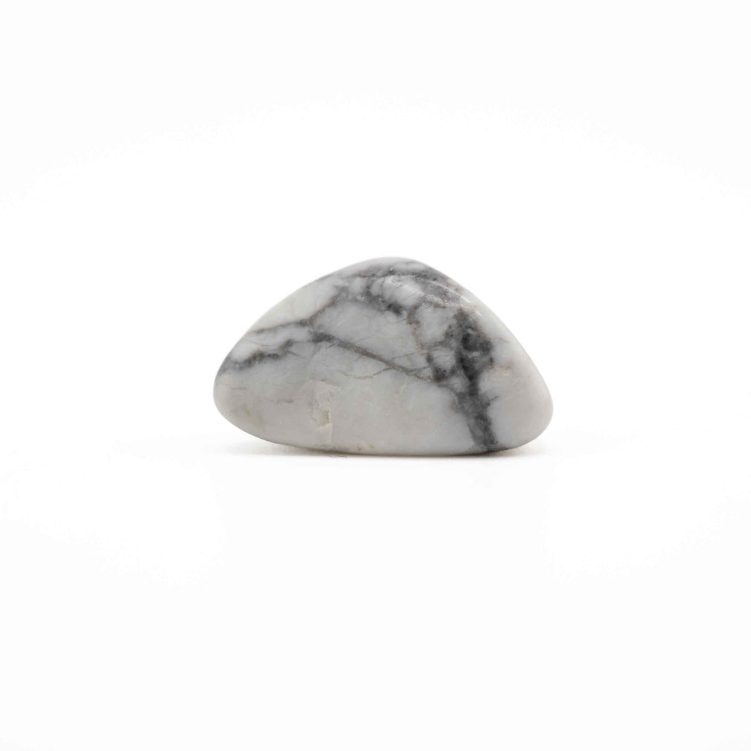A small polished howlite stone with a smooth teardrop shape, featuring a light gray and white base with dark gray to black veining, set against a plain white background.