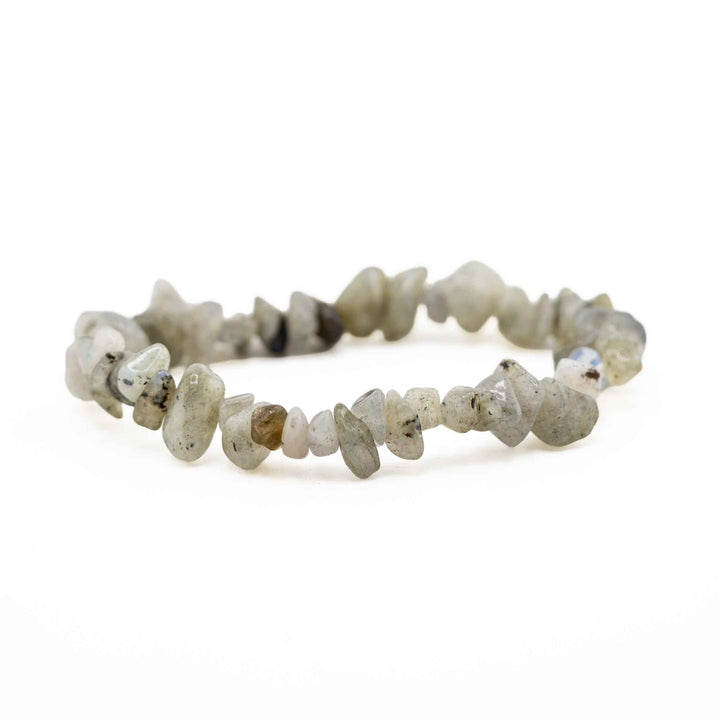 Side view resting shot of a Labradorite chip stone bracelet displaying smooth, polished greenish-grey crystal chips