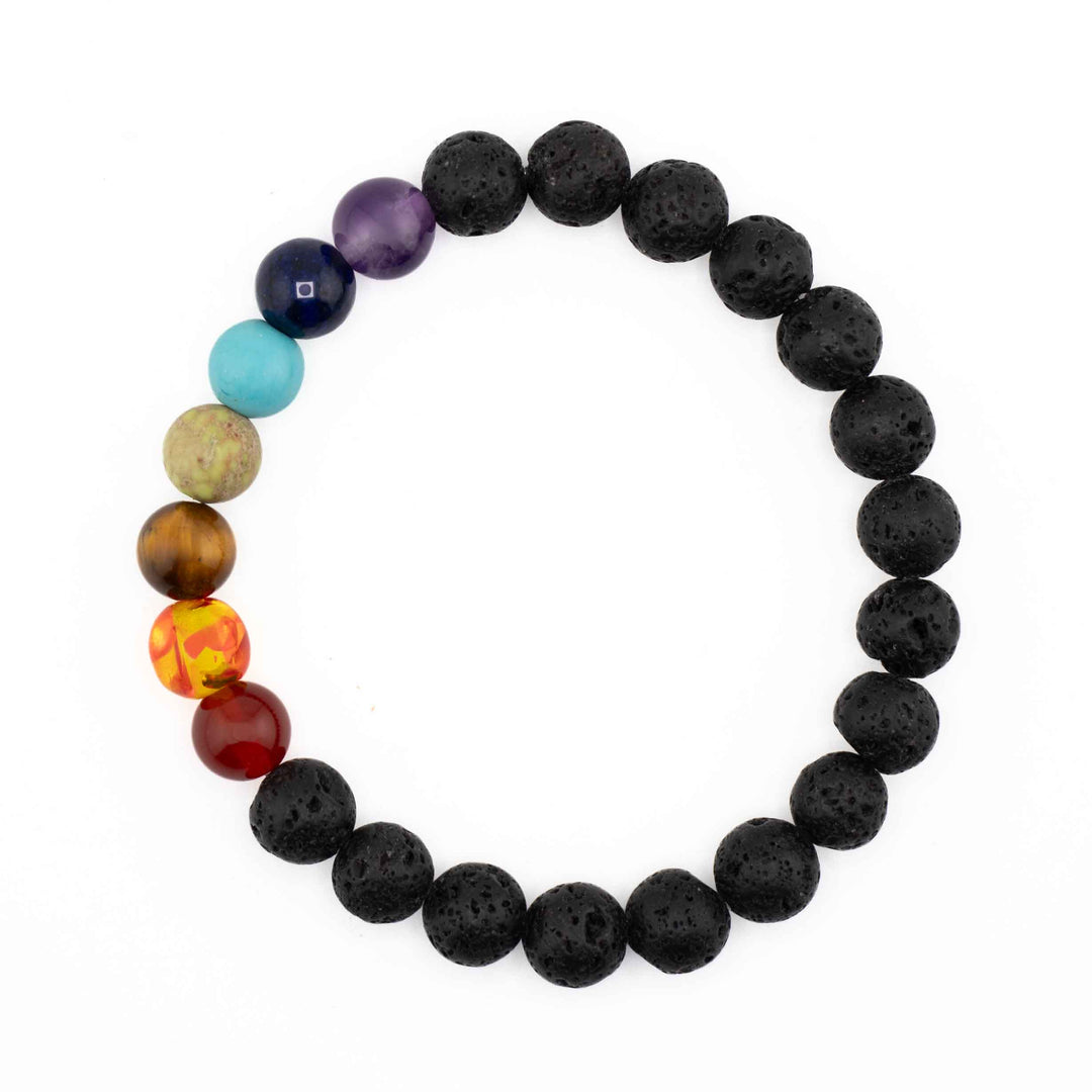 Black porous lava stone beaded bracelet featuring a row of seven colorful chakra gemstone beads against a white background