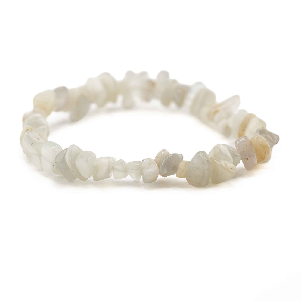 Side view resting shot of a Moonstone chip bead bracelet displaying smooth, irregular polished gemstone chips in subtle off-white hues