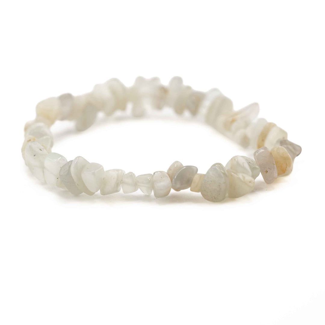 Side view resting shot of a Moonstone chip bead bracelet displaying smooth, irregular polished gemstone chips in subtle off-white hues
