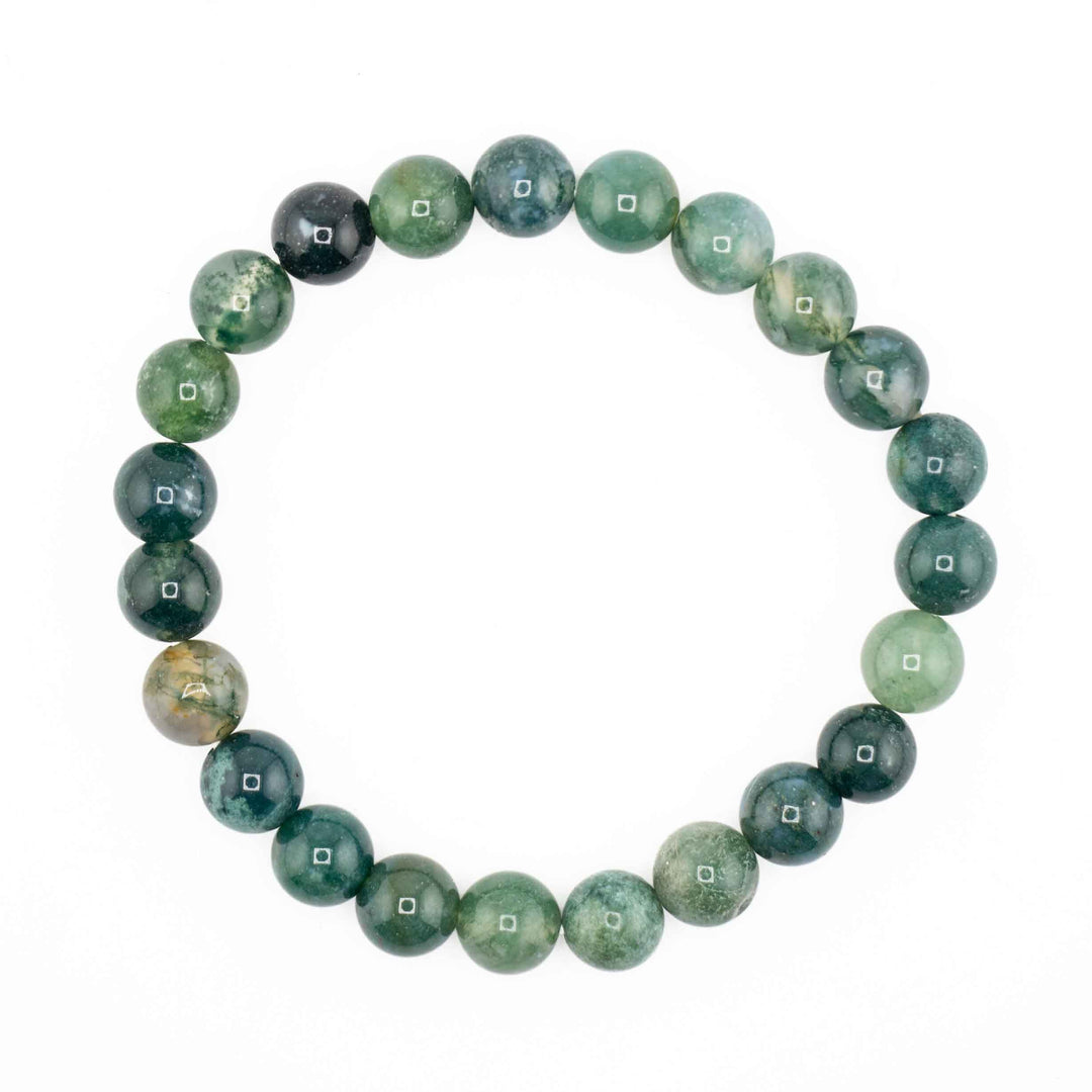 Natural Moss Agate beaded stretch bracelet featuring round forest green gemstone spheres with marbled milky quartz patterns
