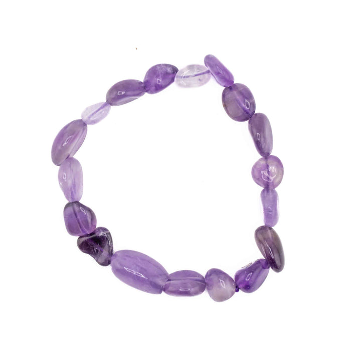 A stretch bracelet featuring chunky, freeform Natural Amethyst gemstone chips in varying shades of translucent purple, centered on a white background.