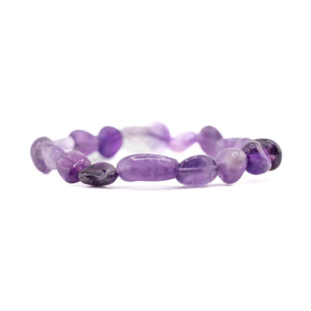 A horizontal, eye-level view of the Natural Amethyst freeform bracelet, focusing on the organic shapes and rich purple hues of the gemstone chips against a white background.