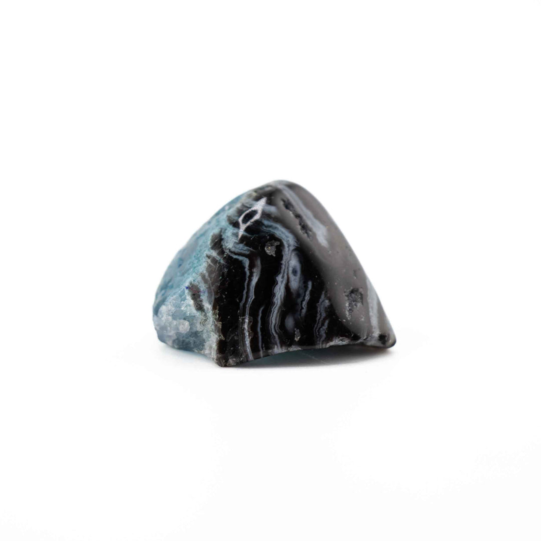 A rounded, triangular banded agate tumbled stone positioned centrally against a solid white backdrop.