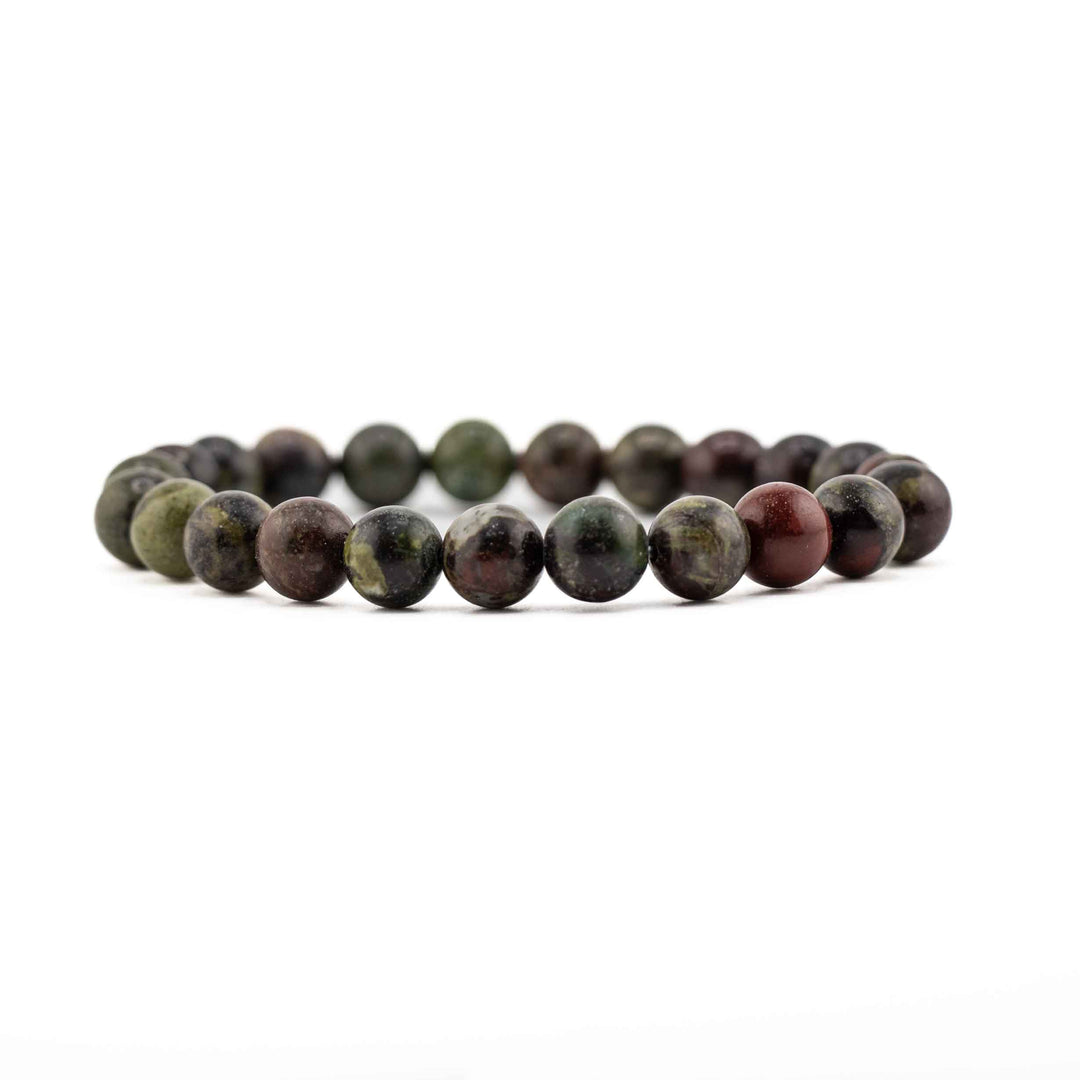 A stretch bracelet featuring round, polished Natural Dragon Blood Jasper beads in shades of deep green and earthy red on a white background.