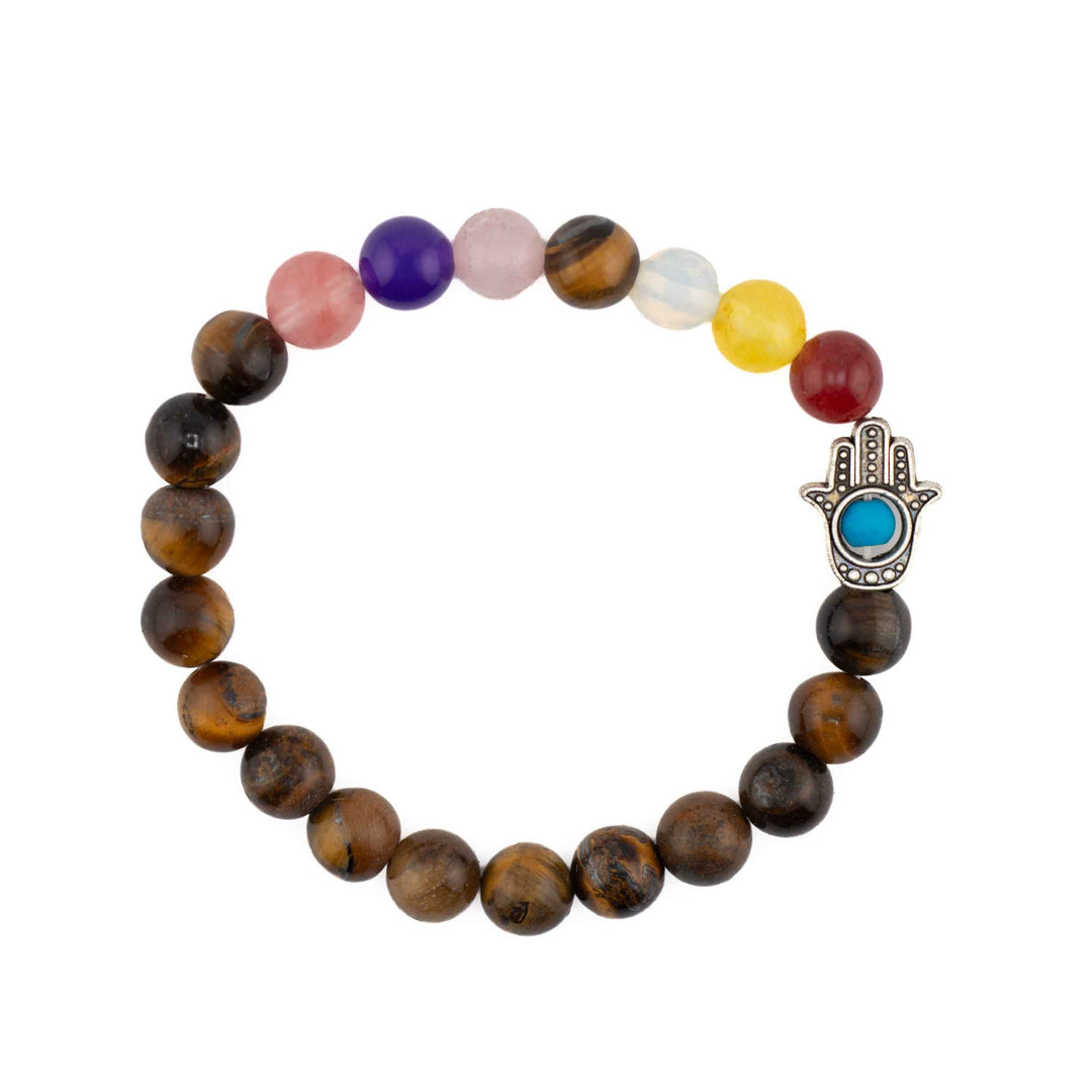 Tiger Eye beaded chakra bracelet with colorful gemstone accent beads and a silver Hamsa hand charm with a turquoise evil eye centerpiece