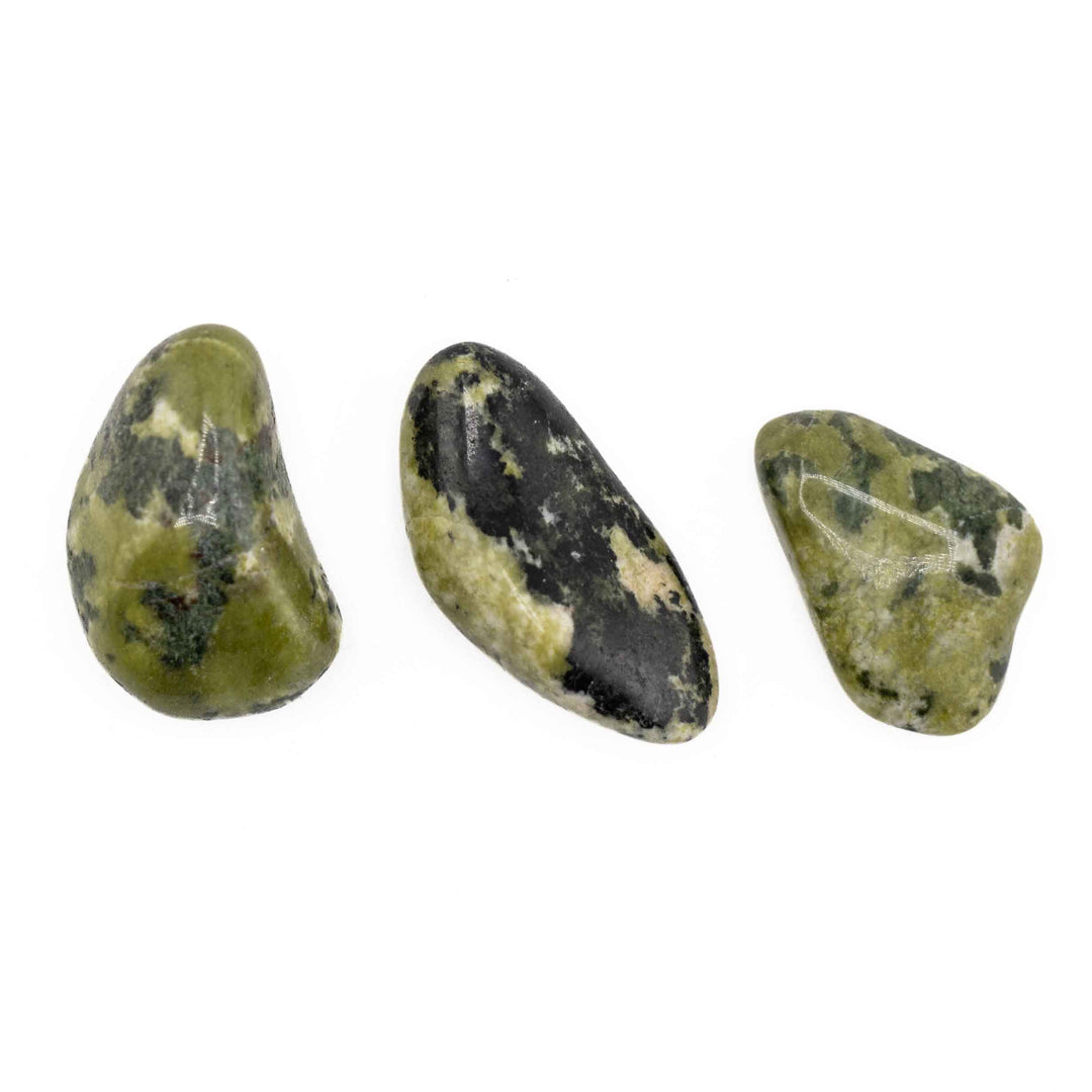 Set of three polished Nephrite Inca Jade tumbled stones showing distinct natural shapes, glossy finishes, and green mineral patterns