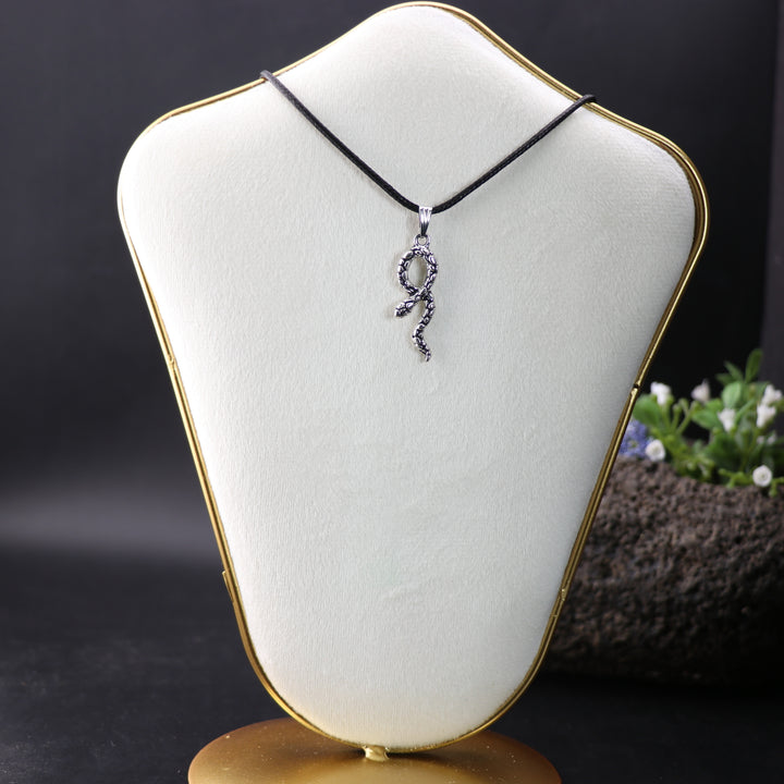 Mystic Serpent Charm: Handcrafted Silver-Colored Brass Snake Pendant