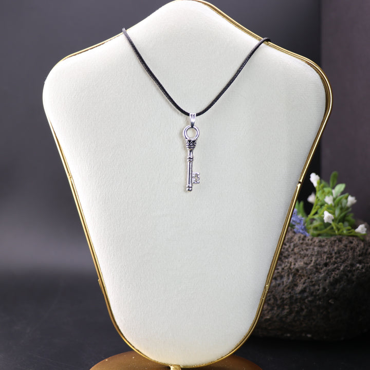 Silver-Colored Key Shaped Brass Pendant - Handcrafted Artisan Jewelry for Mindful Living