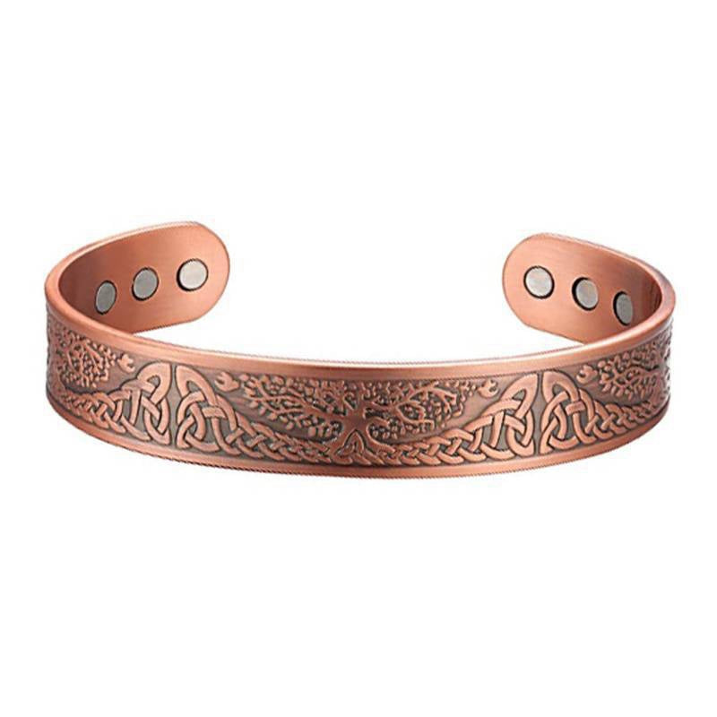 Copper bracelet featuring an embossed Celtic knot and Tree of Life design on a cuff with six embedded magnets