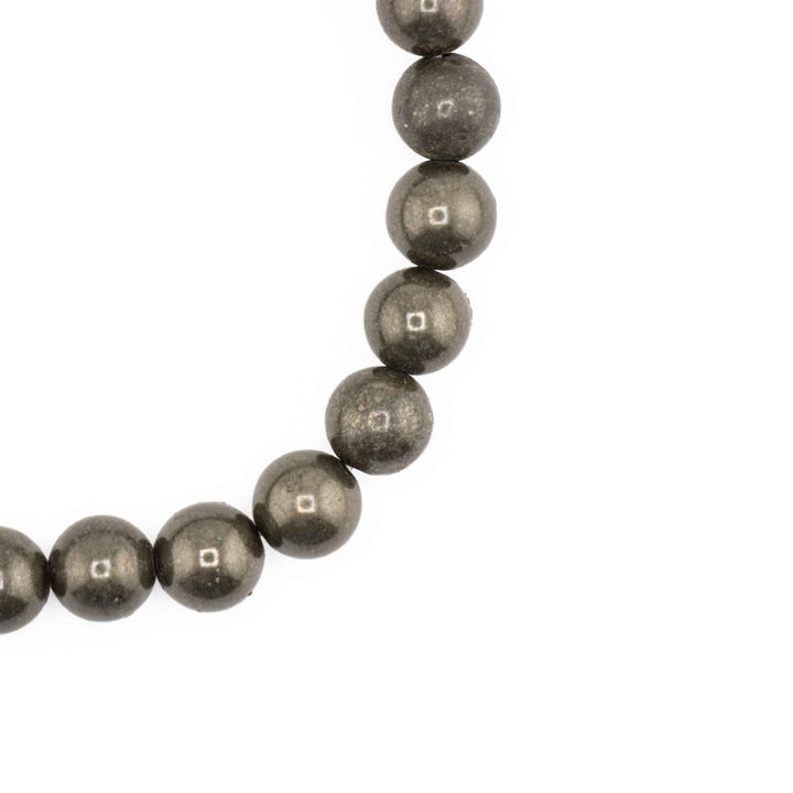 Close-up detail of round Frosted Black Onyx beads displaying a velvety matte black finish