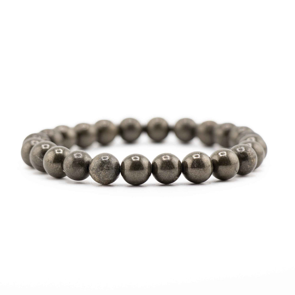 Side view resting shot of a Frosted Black Onyx gemstone beaded stretch bracelet lying flat on a white background