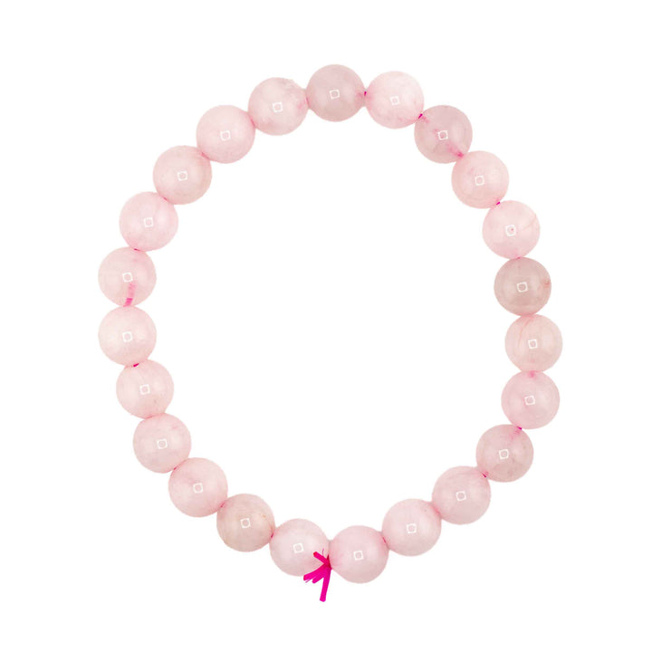 Natural Rose Quartz beaded stretch bracelet featuring smooth, translucent light pink gemstone spheres with a bright pink cord tie