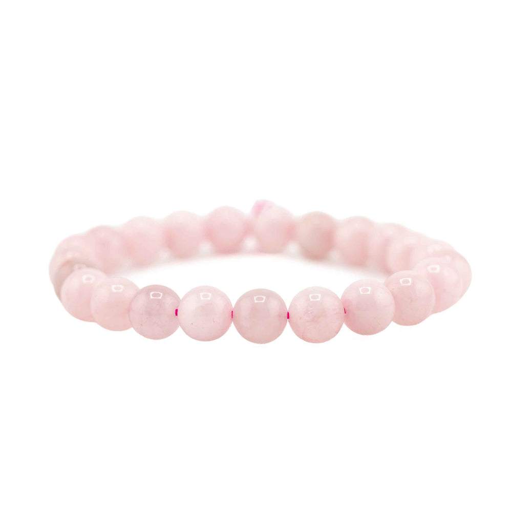 Side view resting shot of a natural Rose Quartz beaded gemstone bracelet on a clean white background