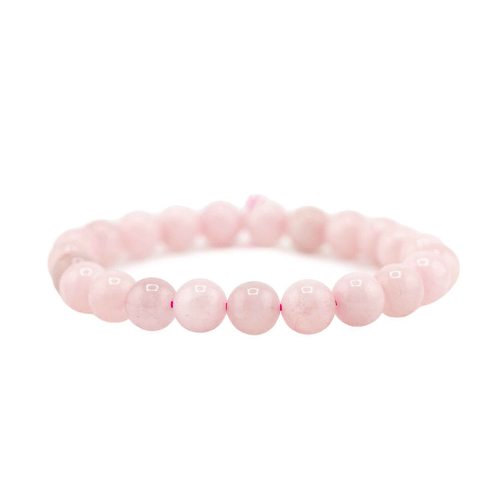 Side view resting shot of a natural Rose Quartz beaded gemstone bracelet on a clean white background