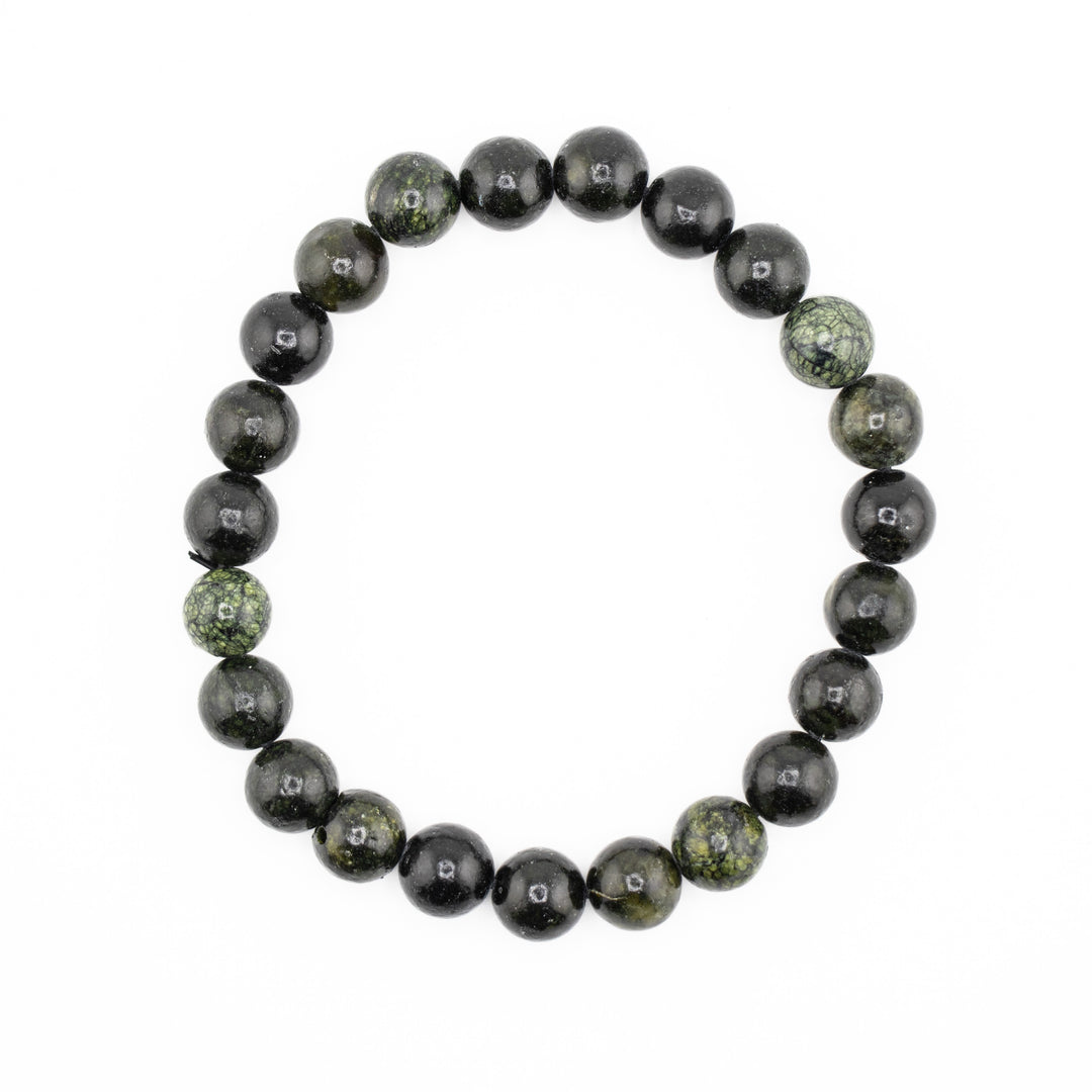 A dark green and black beaded bracelet featuring some beads with lighter green marbled patterns forming a circle on a white background