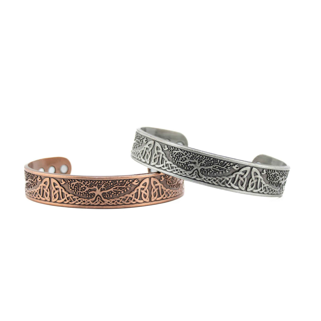 A group of copper bangles featuring various "Tree of Life" charms and decorative beads, showcased together on a white background.