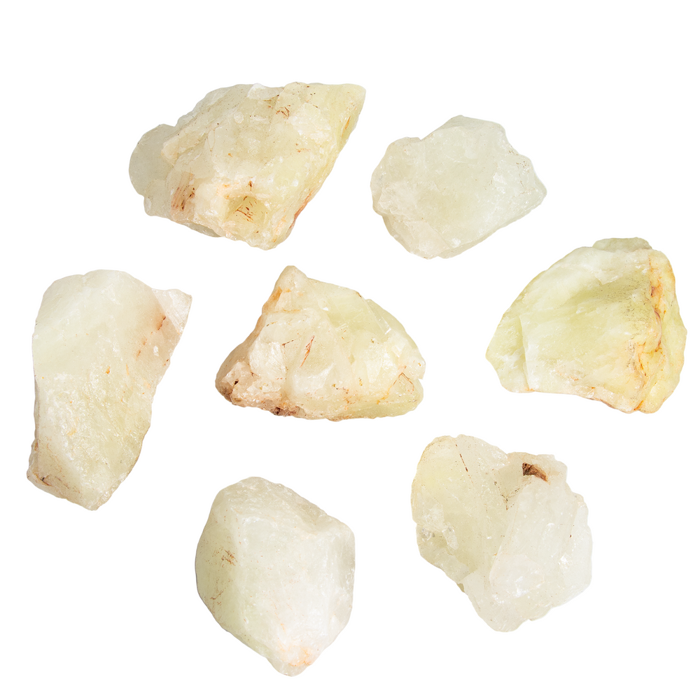 Seven rough raw Grossular Garnet stones in varying light green to yellowish-white colors with reddish-brown inclusions