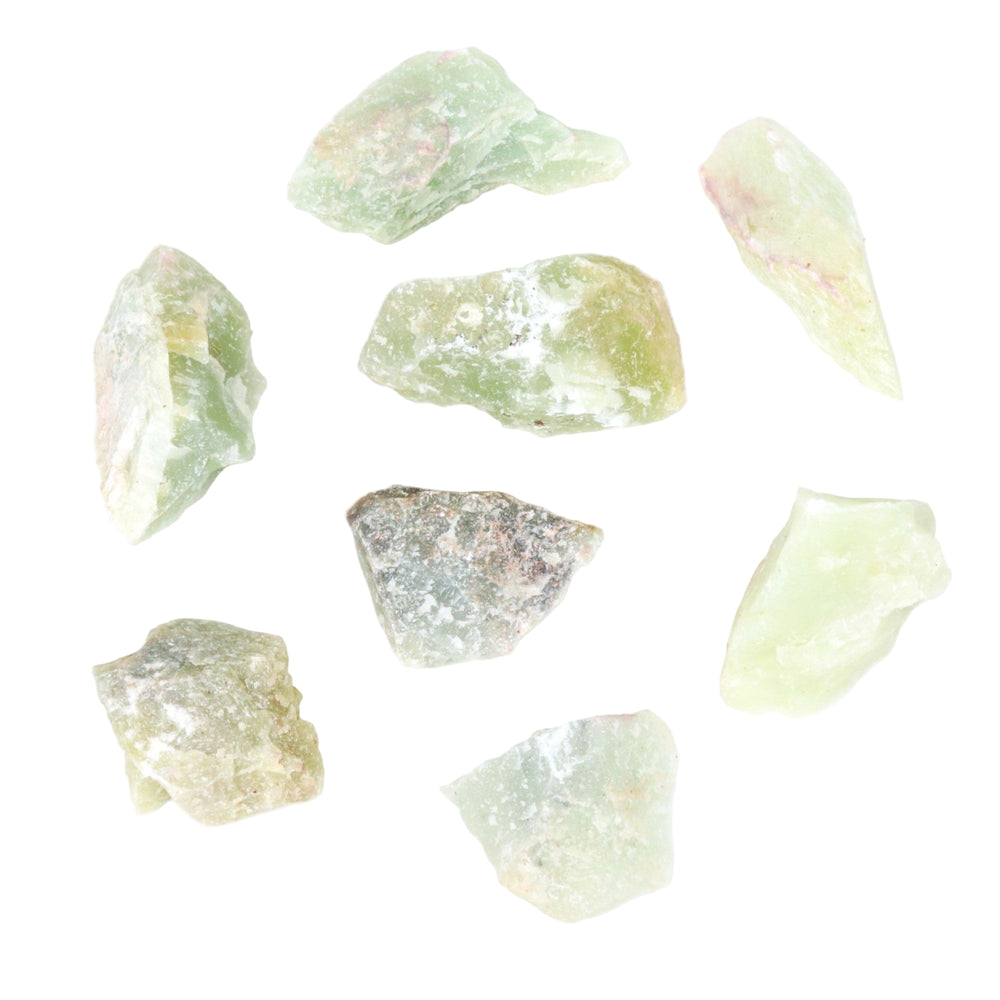 Eight rough unpolished light green mineral stones displaying varying shades and subtle pink and grey inclusions on a plain white background