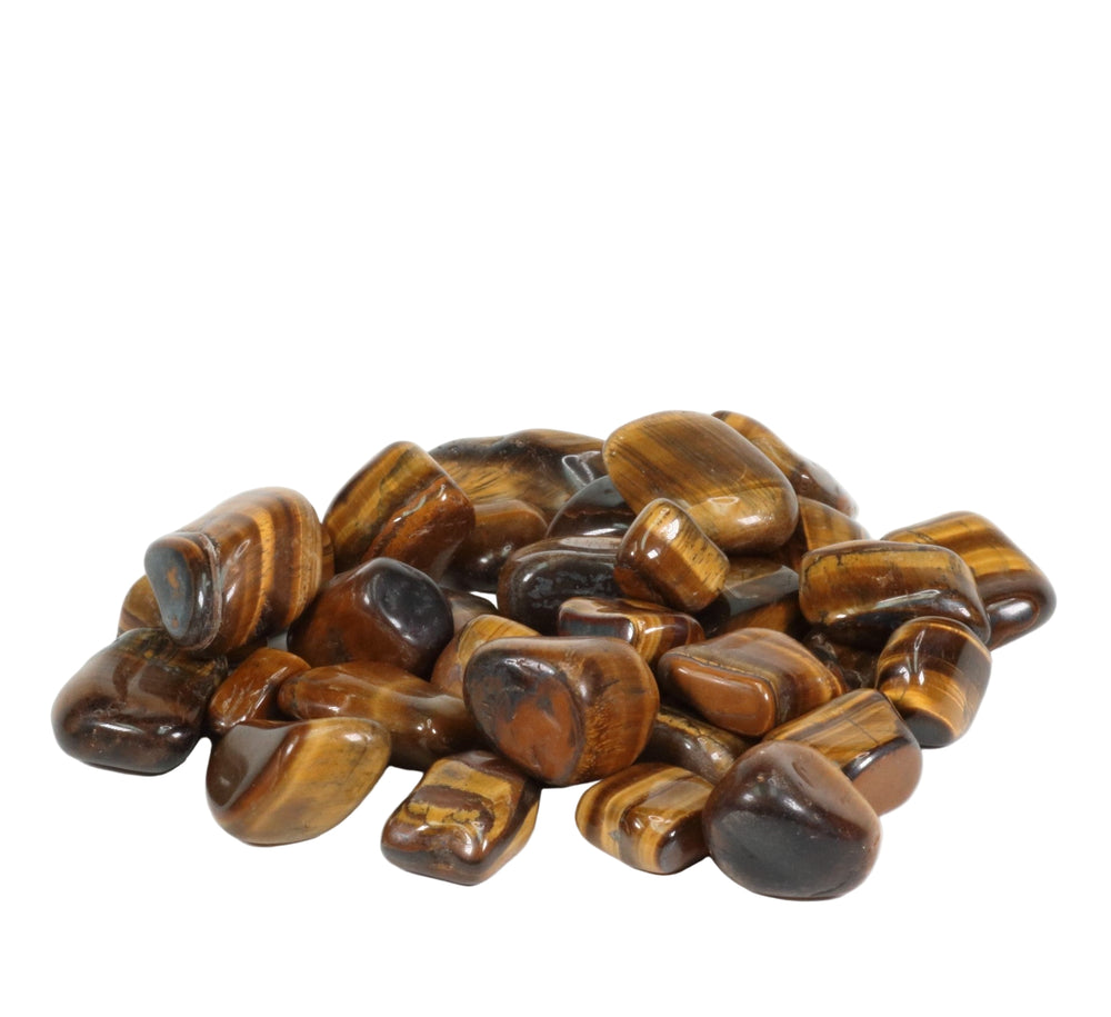 A pile of polished tumbled Tiger's Eye stones exhibiting rich golden-brown hues and characteristic chatoyancy with shimmering striped patterns