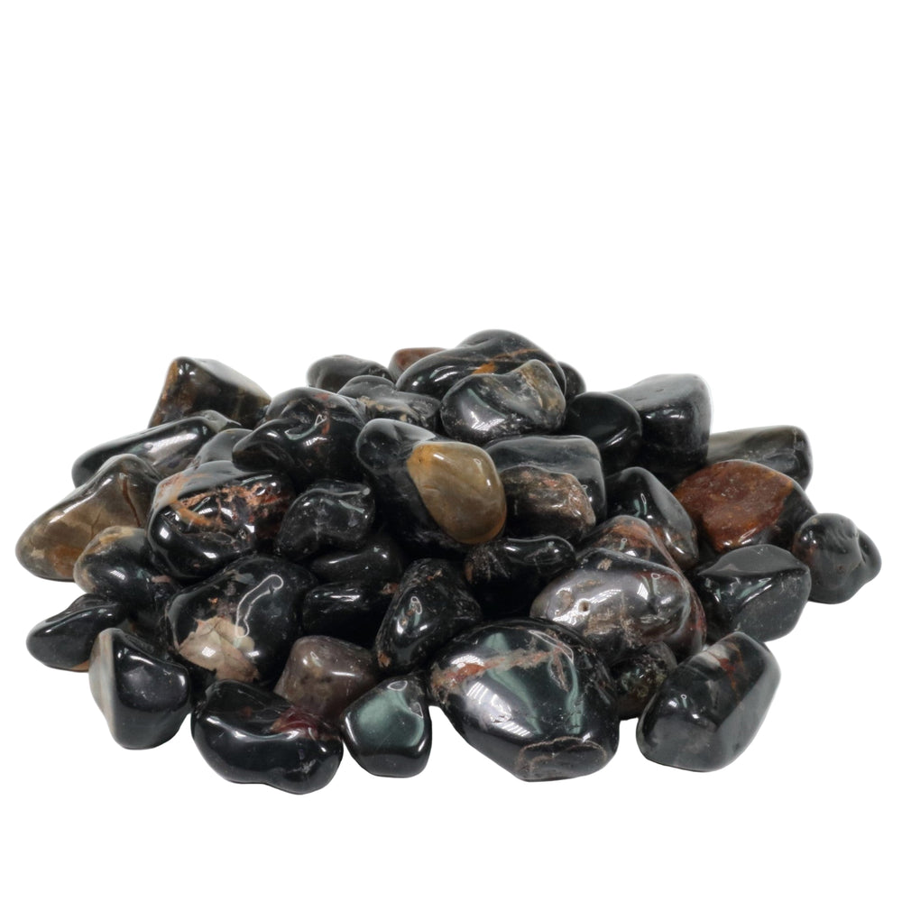 Photograph of a mound of glossy black onyx stones with visible reddish-brown, dark green, and greyish banding against a white background