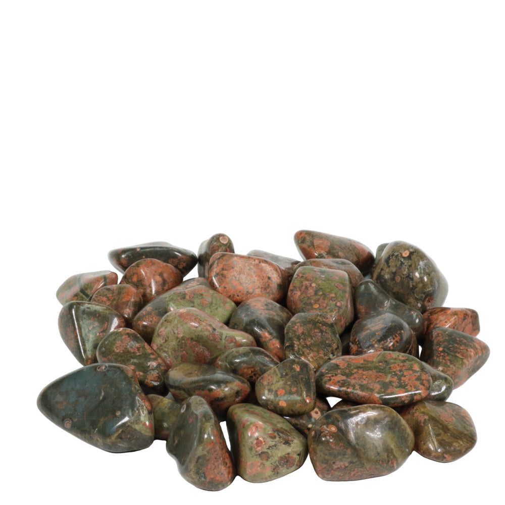 Pile of polished unakite tumbled stones showcasing mottled green and salmon-pink hues