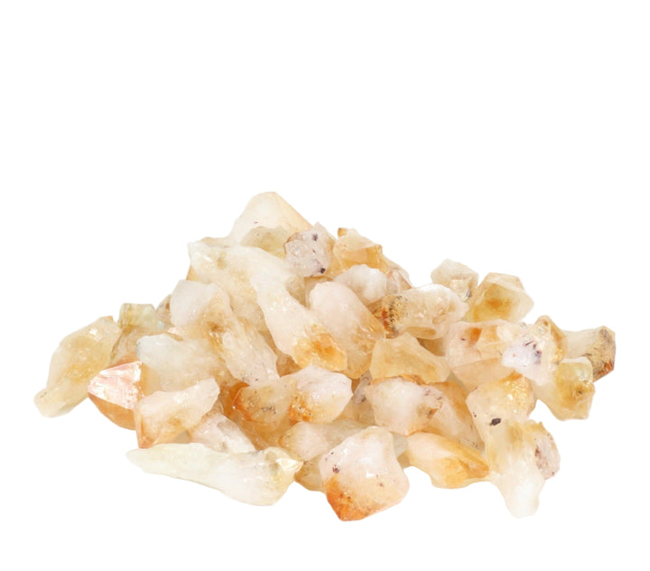 A cluster of rough-cut natural crystals displaying translucent golden yellow and orange tones with opaque white facets and subtle dark specks