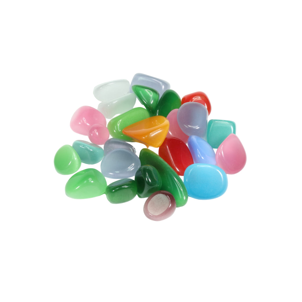 Still life photography: a pile of smooth glossy translucent cat's eye stones in vibrant colors including pink green blue orange and red on a crisp white studio background