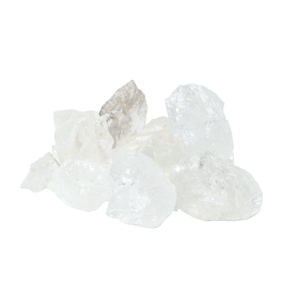 A studio shot of several clear raw quartz crystals displaying translucent, icy textures and irregular rough facets on a clean white background